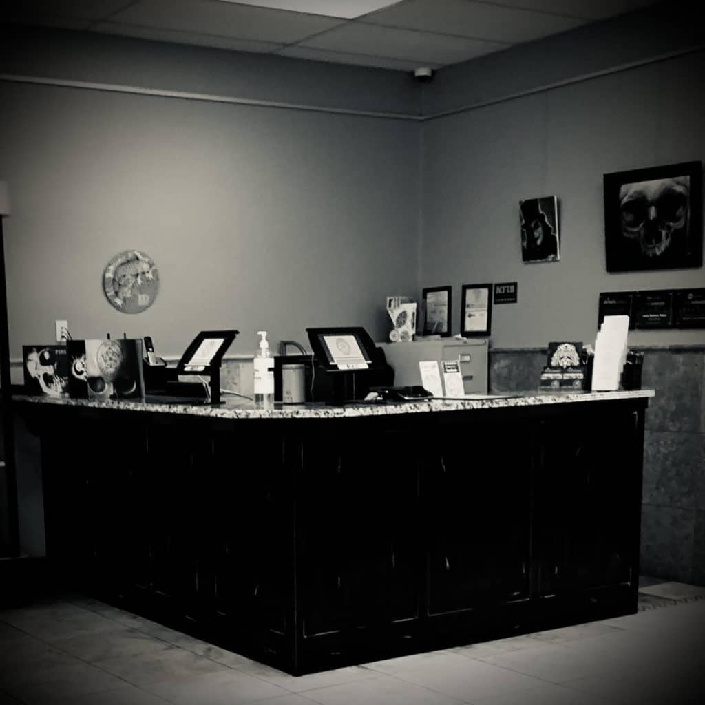 Our studio associate desk, where we can help you choose the best artist for you.