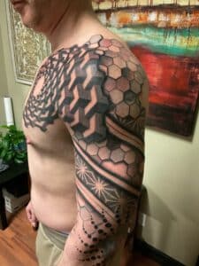 Trivial tattoo on the chest and arm