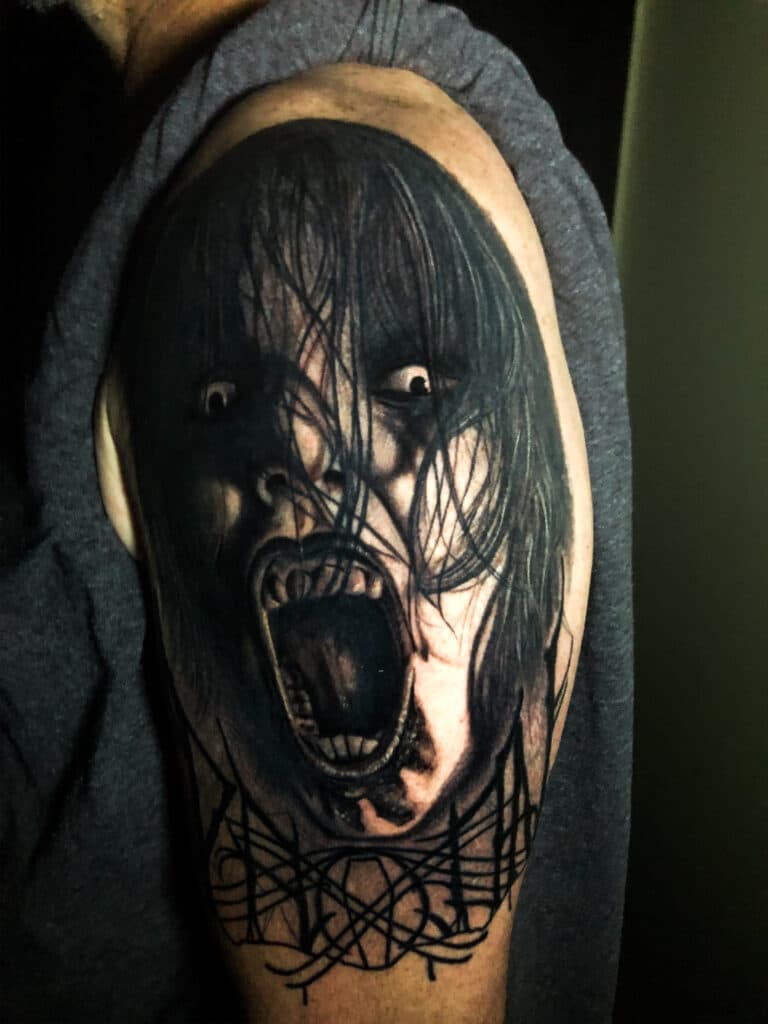 This creepy dark art piece by Jared would make a great Halloween tattoo.