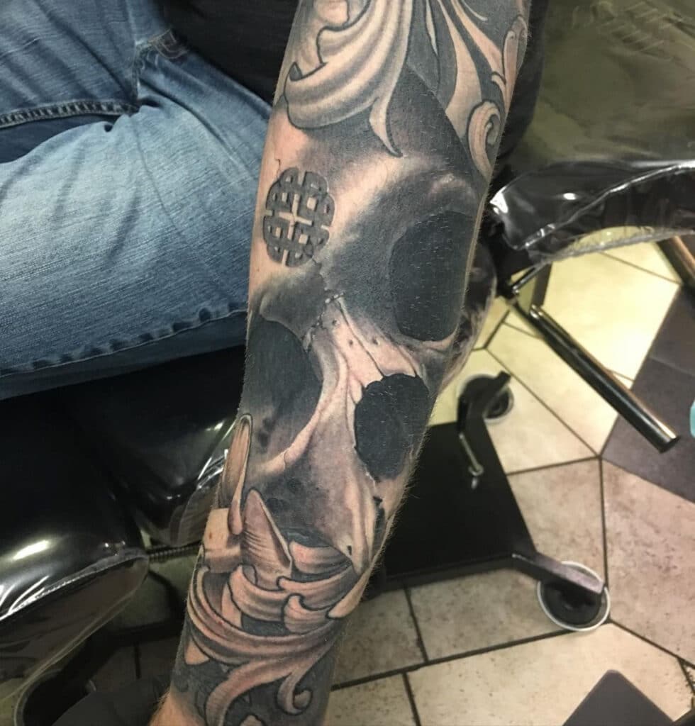 This dark and spooky skull tattoo was done by Jared