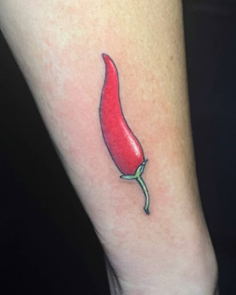 A simple chili pepper tattoo by Leah
