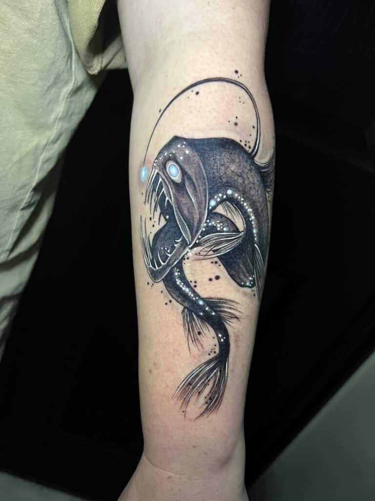 An elaborate viper fish tattoo by Leah