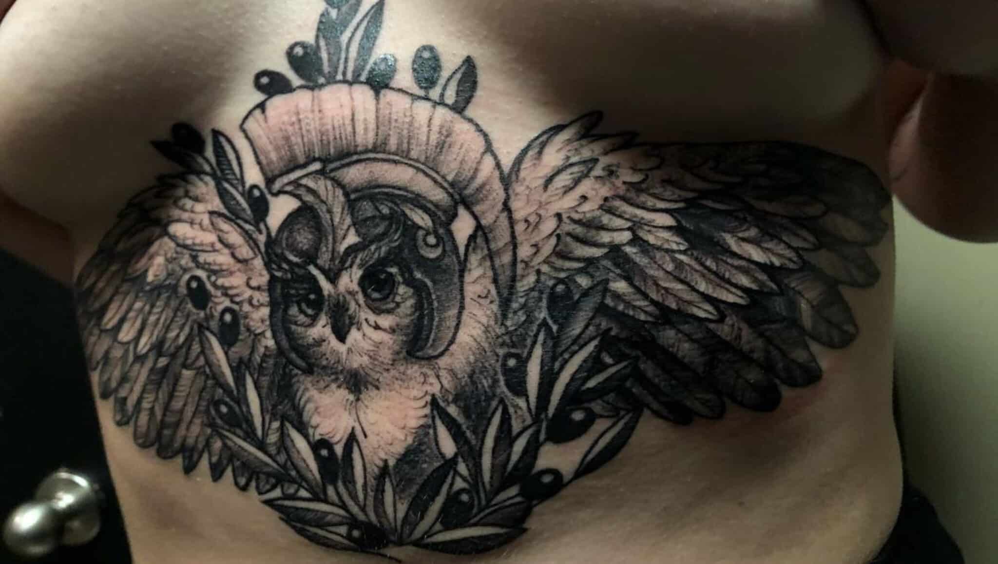 Owl tattoo on the stomach